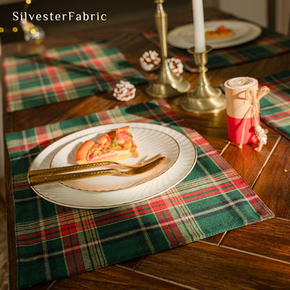 green Christmas plaid placemats laid flat on dining table