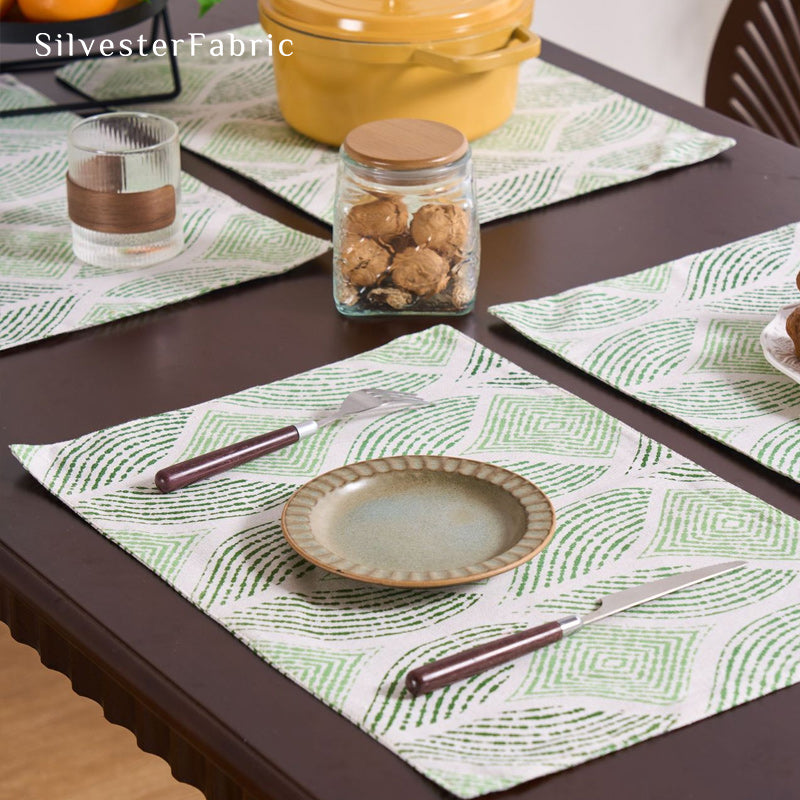 green textured farmhouse placemats laid flat on dining table
