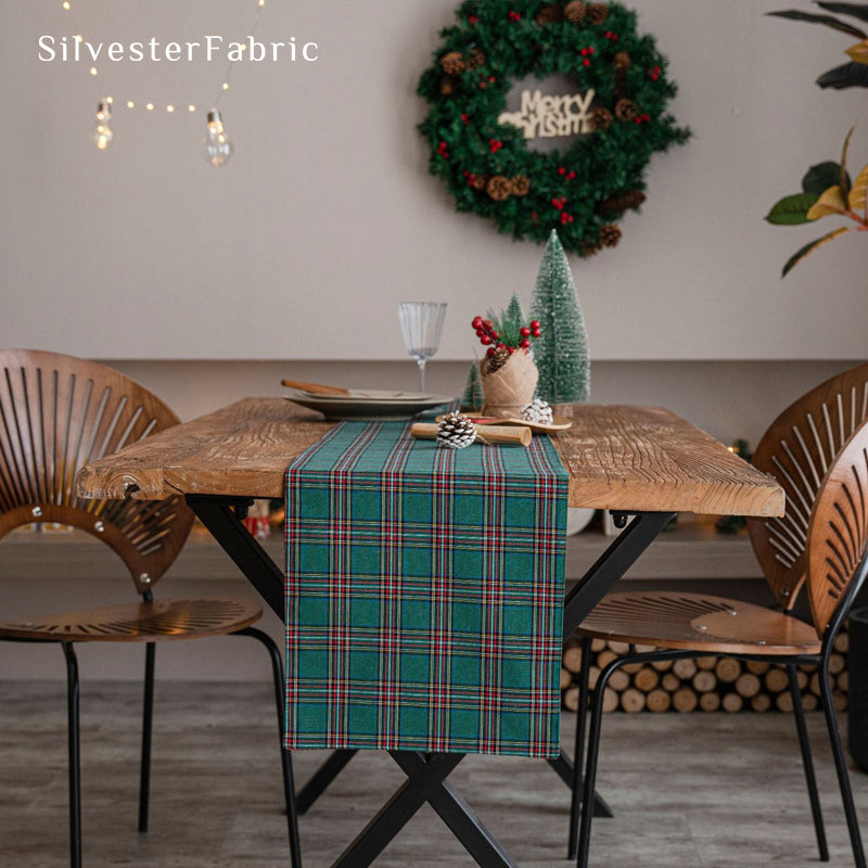 green plaid table runner laid flat on dining table