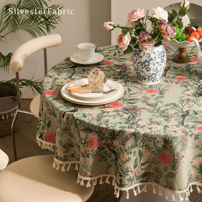 green round  farmhouse  floral tablecloth draped over rectangle table