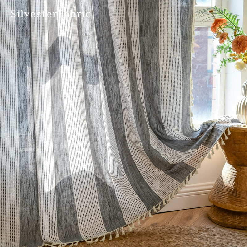 Close‑up of Green embroidered curtain corner