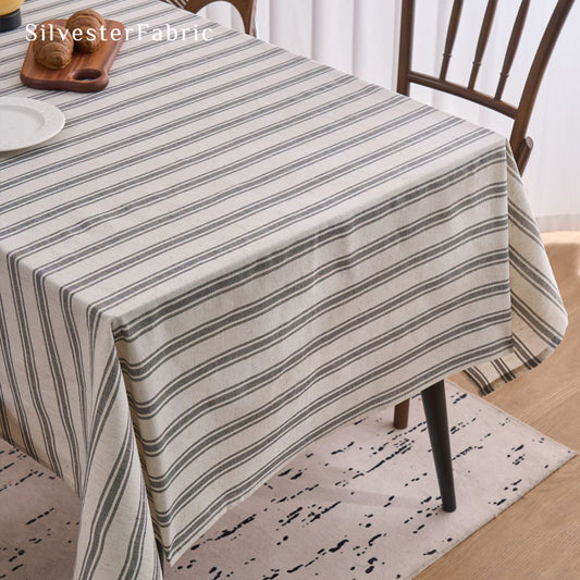 grey striped farmhouse tablecloth laid flat on dining table