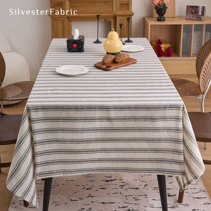 grey striped farmhouse tablecloth draped over rectangle table