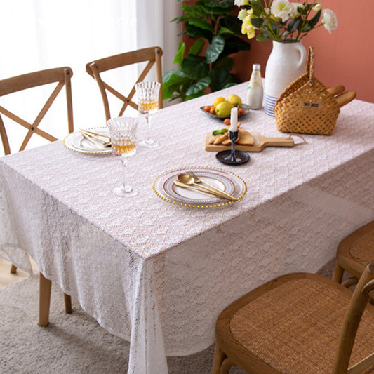 The rectangle table was covered with a white lace tablecloth