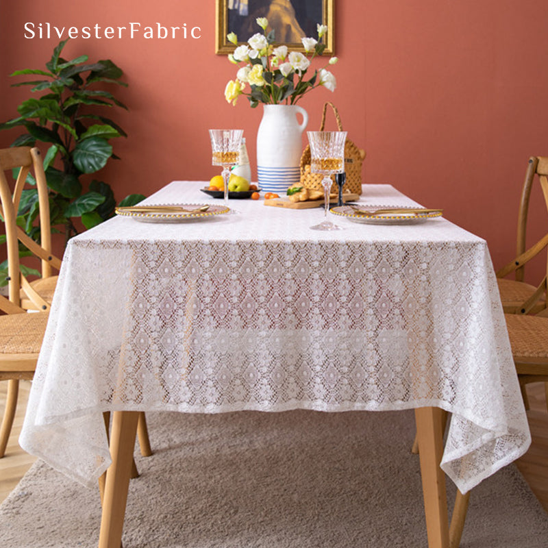 The rectangle table was covered with a white lace tablecloth