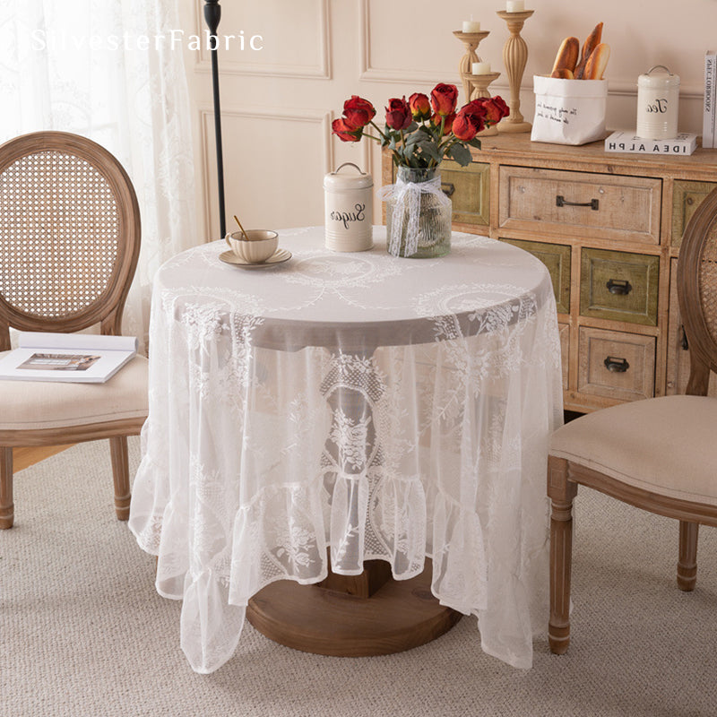 Gorgeous white lace tablecloth on the dining table