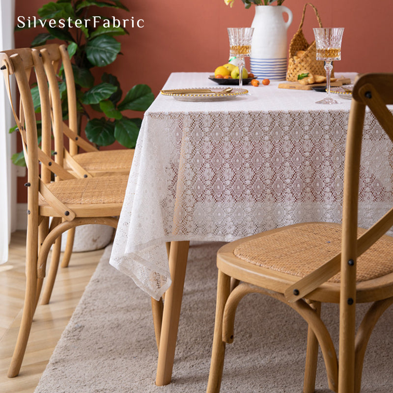 The rectangle table was covered with a white lace tablecloth