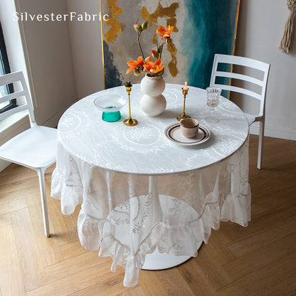 Gorgeous white lace tablecloth on the dining table