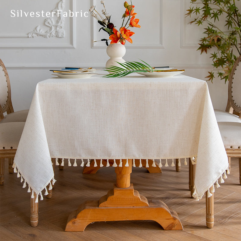 Off White linen tablecloth covers a rectangular table