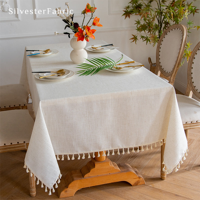 Off White linen tablecloth covers a rectangular table