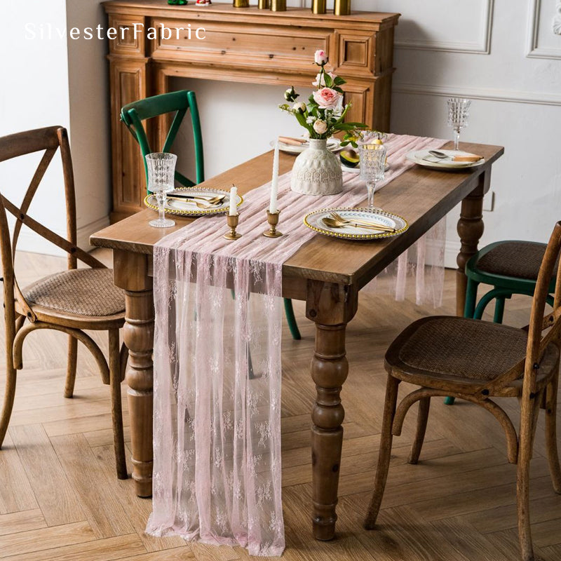 pink lace table runner draped over rectangle table
