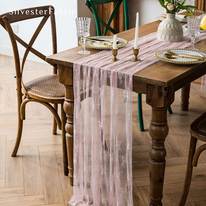 pink lace table runner laid flat on dining table