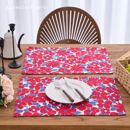 red floral farmhouse placemats laid flat on dining table