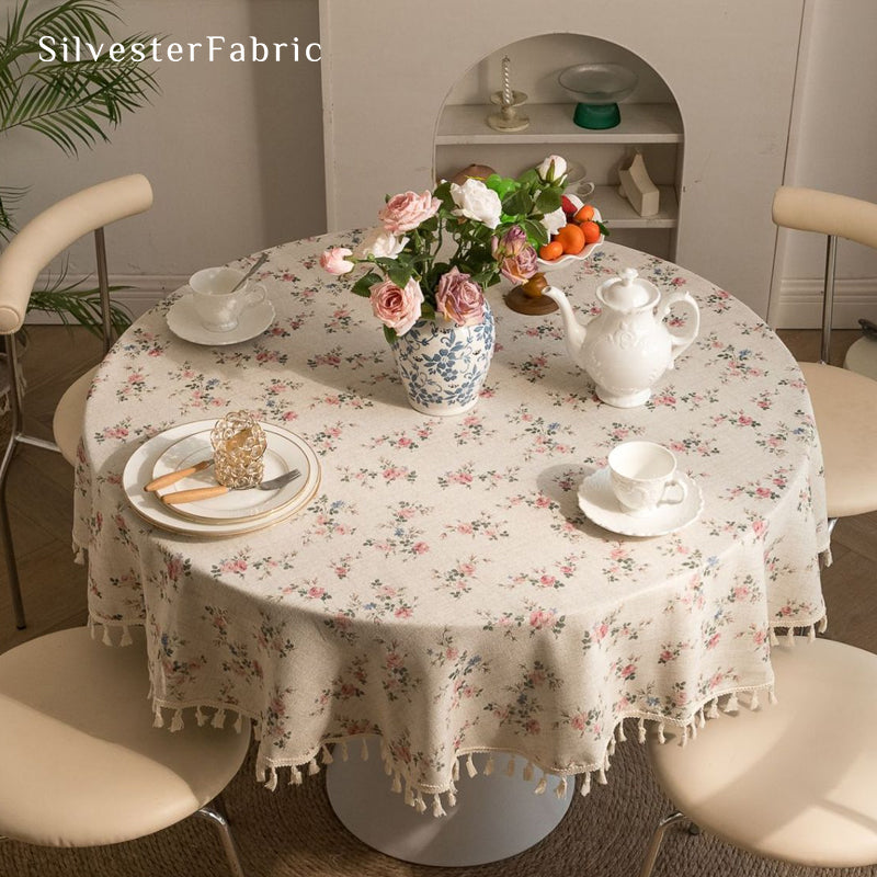 farmhouse floral round tablecloth laid flat on dining table