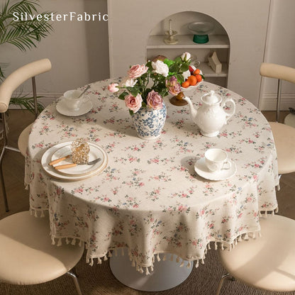 farmhouse floral round tablecloth laid flat on dining table