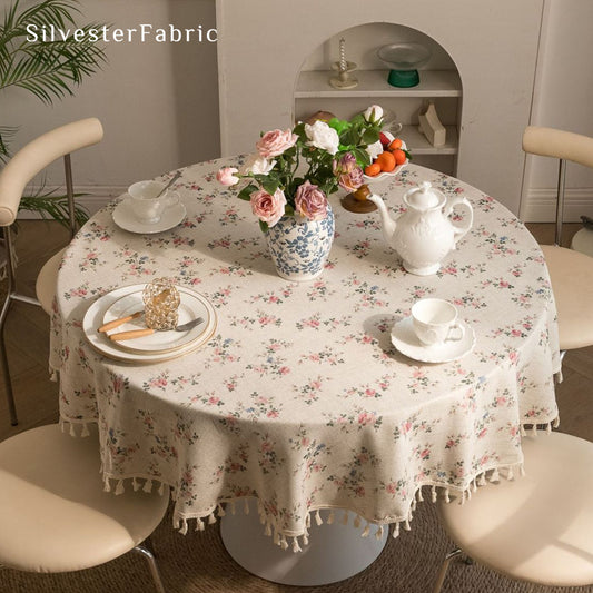 farmhouse floral round tablecloth laid flat on dining table