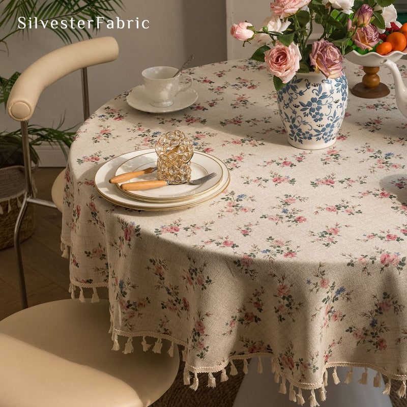 farmhouse floral round tablecloth laid flat on dining table