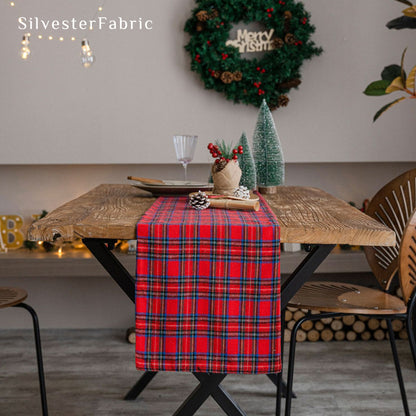 red plaid table runner laid flat on dining table