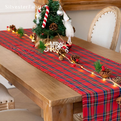 red plaid table runner draped over rectangle table