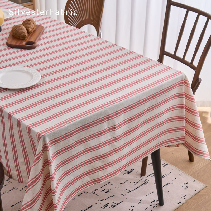 red striped farmhouse tablecloth laid flat on dining table