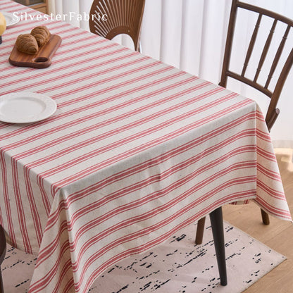 red striped farmhouse tablecloth laid flat on dining table