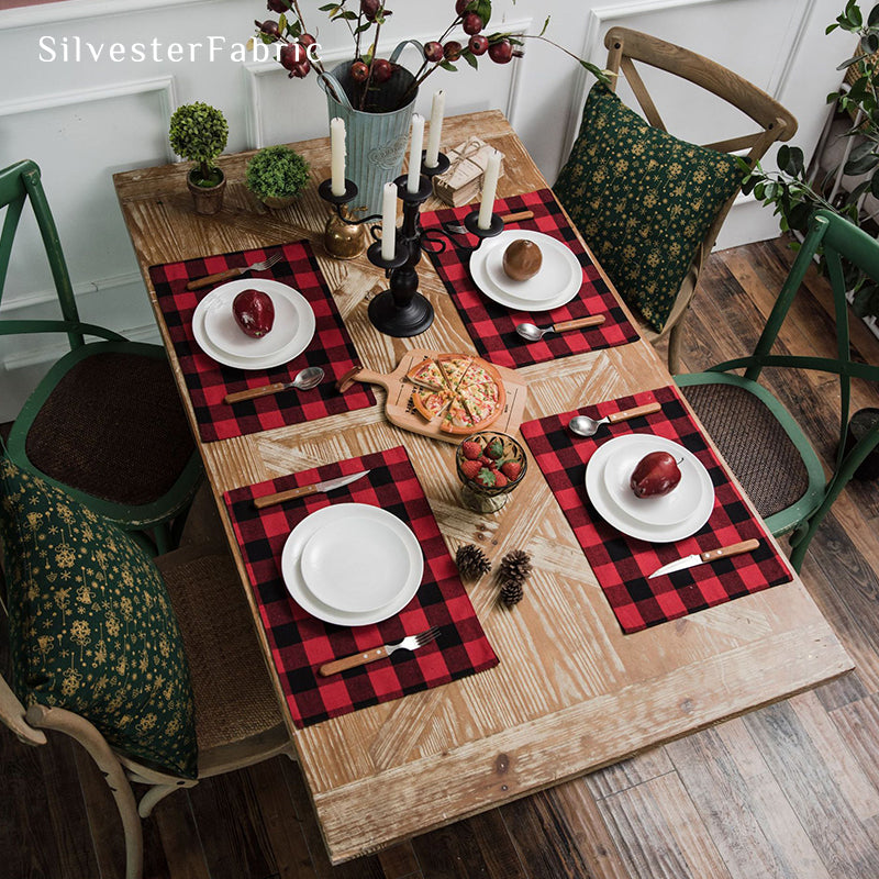 Red Christmas table runner on a wooden table