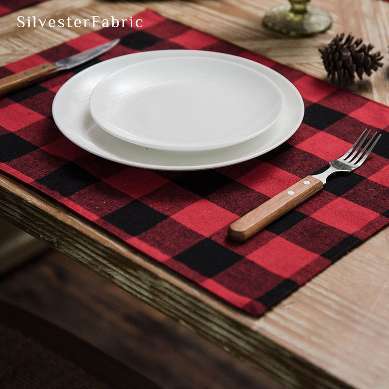 Red Christmas table runner on a wooden table