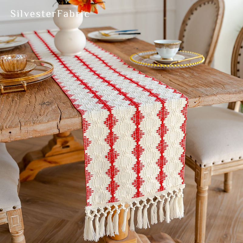 Extra long red table runner on a wooden table