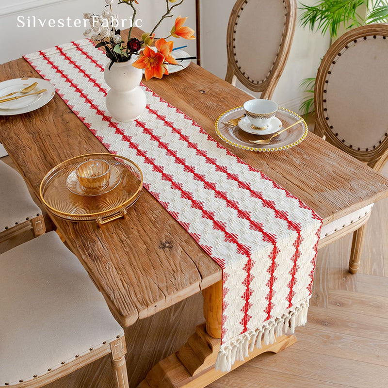 Extra long red table runner on a wooden table