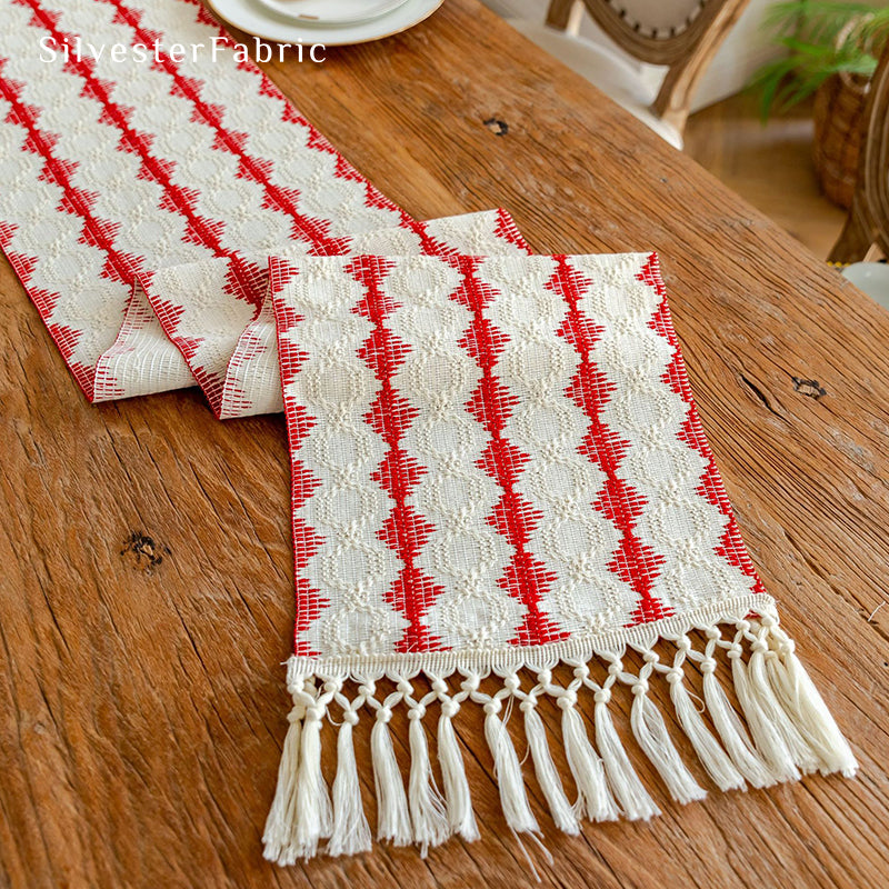 Extra long red table runner on a wooden table