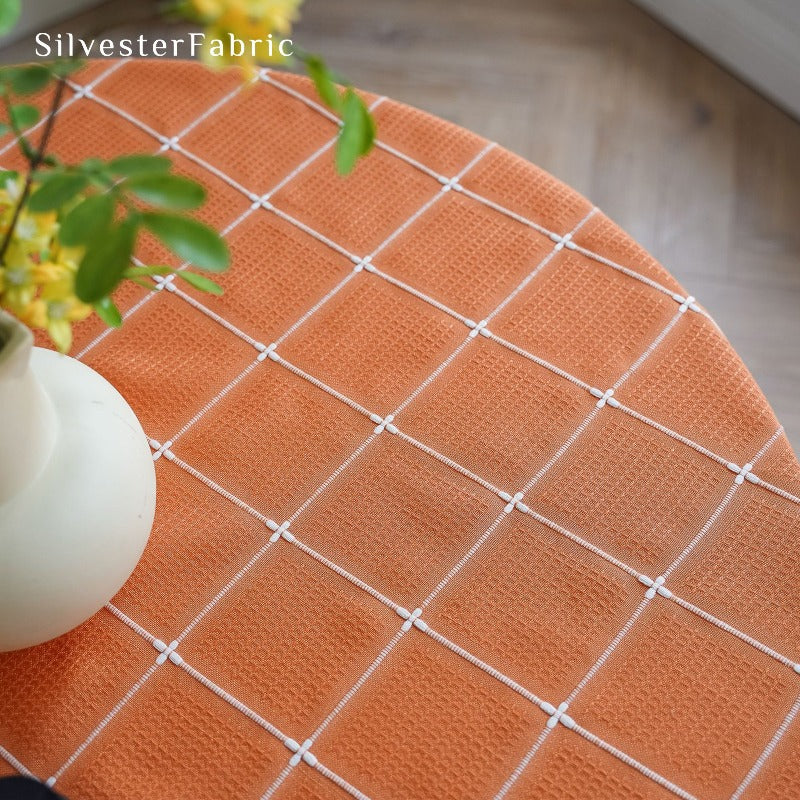 Orange plaid tablecloth on the table