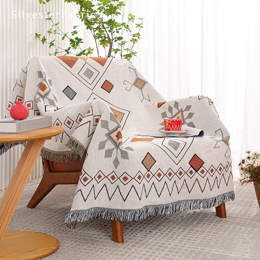 White geometric modern throw blanket on sofa