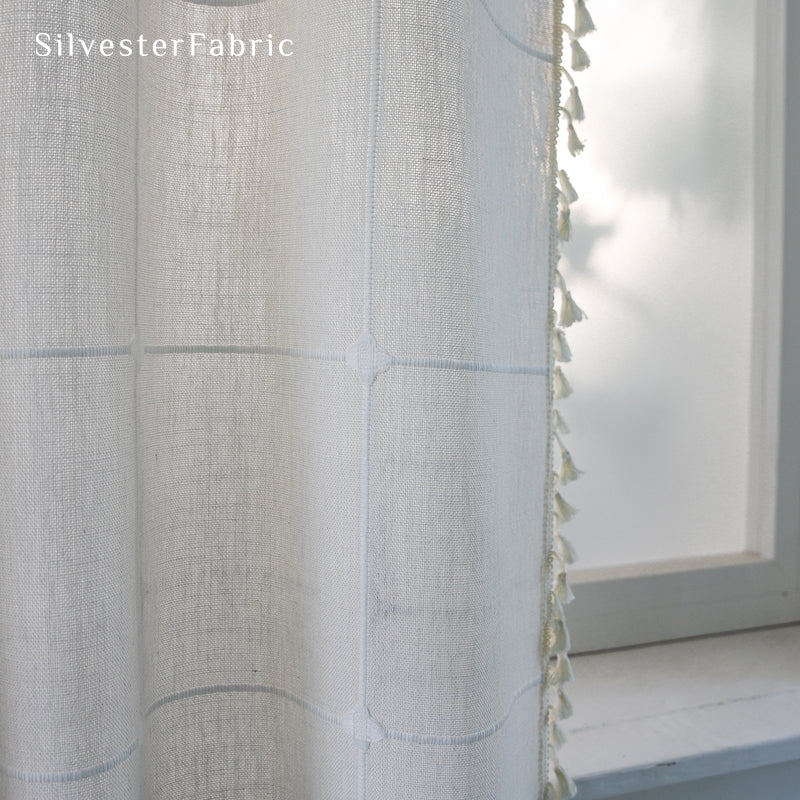 tassel trim on white plaid farmhouse curtain panel