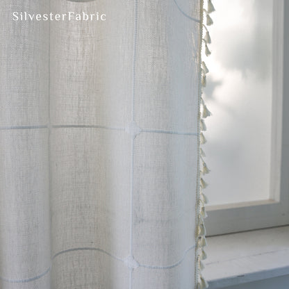 tassel trim on white plaid farmhouse curtain panel