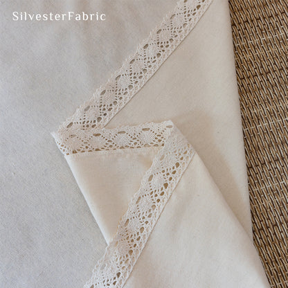 white farmhouse lace curtain fabric close-up