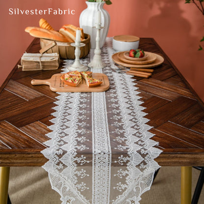 French lace table runner laid flat on dining table