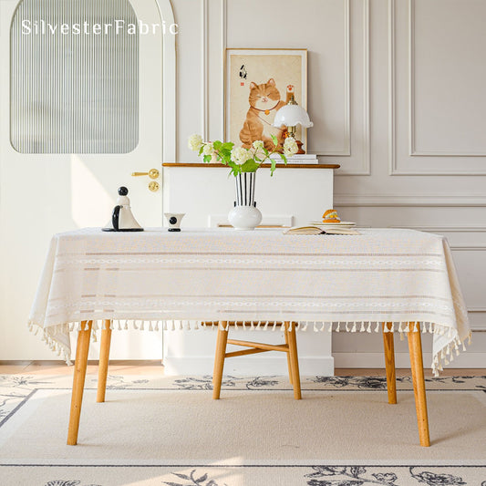 white striped farmhouse tablecloth draped over rectangle table