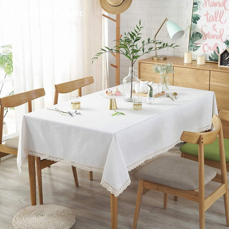solid white farmhouse tablecloth laid flat on dining table