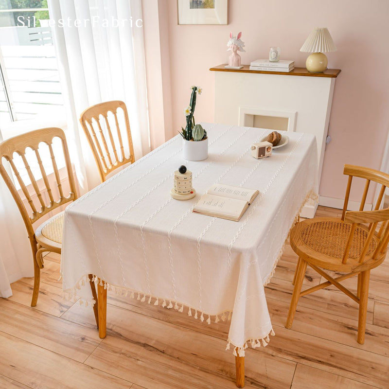 white farmhouse striped tablecloth laid flat on dining table