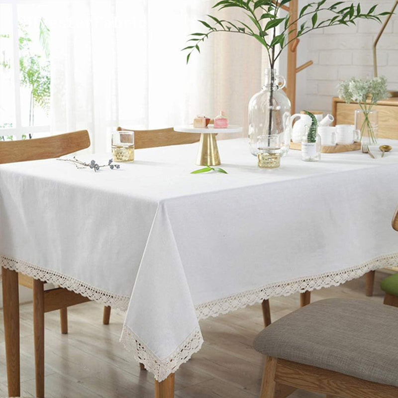solid white farmhouse tablecloth draped over rectangle table