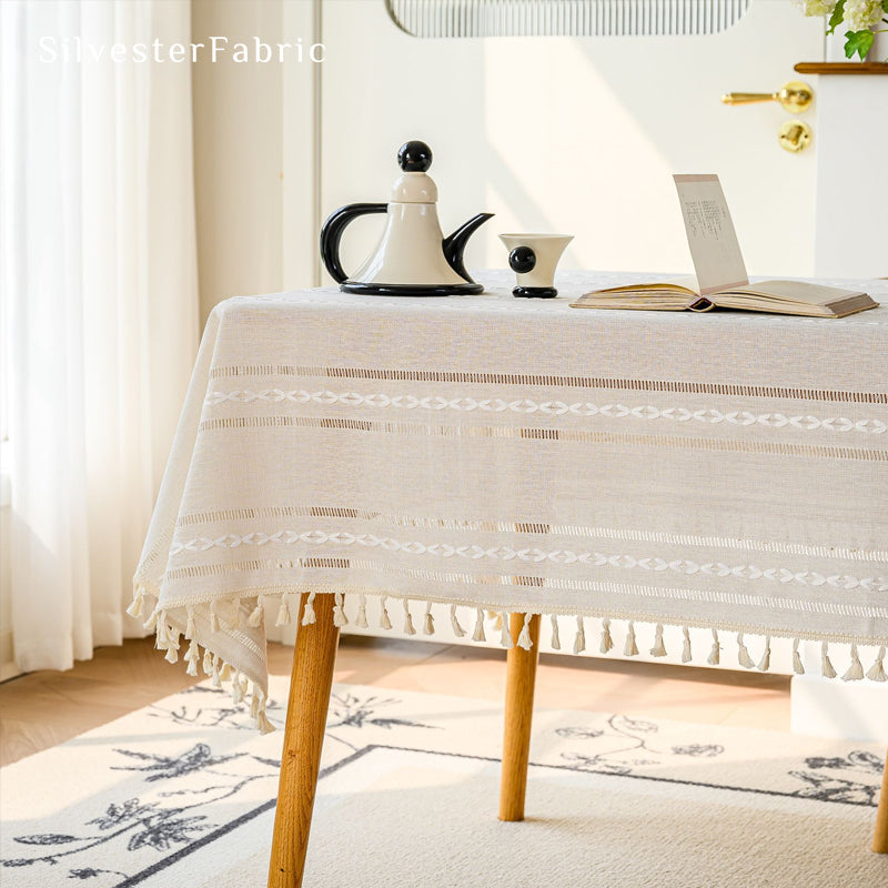 white striped farmhouse tablecloth laid flat on dining table