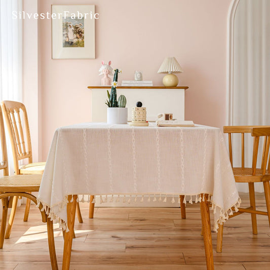 white farmhouse striped tablecloth draped over rectangle table