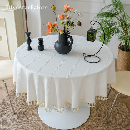 white farmhouse striped tablecloth draped over round table