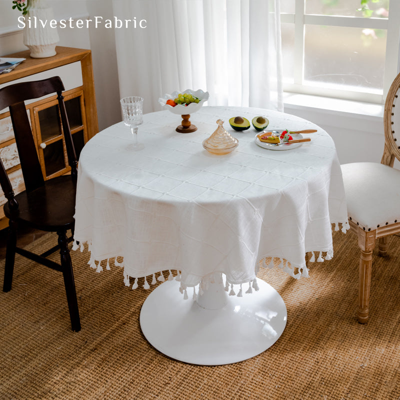 white plaid farmhouse tablecloth folded showing fabric weight