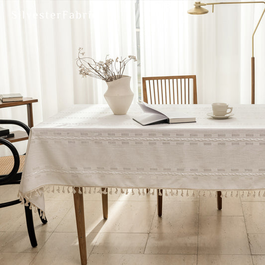white farmhouse rectangle tablecloth laid flat on dining table