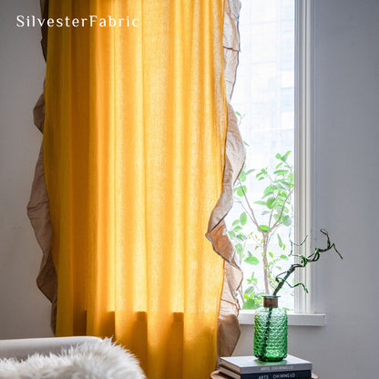 yellow french cotton curtain hanging in window